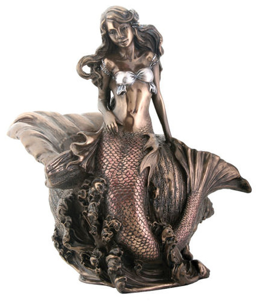 Mermaid sculpture resting on waves in the water master of the sea